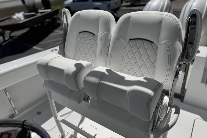 Slide: The Image of 2026 Sportsman Open 252 Center Console boat seats with diamond stitching detail. - 14