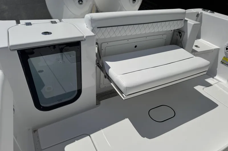 Slide: The Image of 2026 Sportsman Open 252 Center Console boat with foldable white seating. - 15