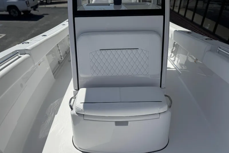 Slide: The Image of 2026 Sportsman Open 252 Center Console boat interior with white seating and sleek design. - 17