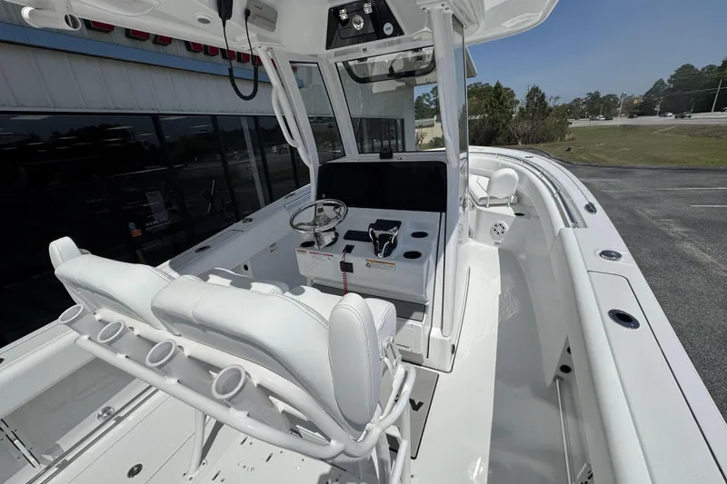 Slide: The Image of 2026 Sportsman Open 252 Center Console boat interior with helm and seating. - 19