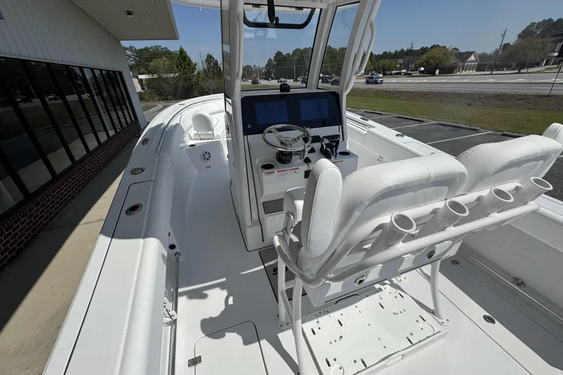 Slide: The Image of 2026 Sportsman Open 252 Center Console boat interior with helm and seating. - 21