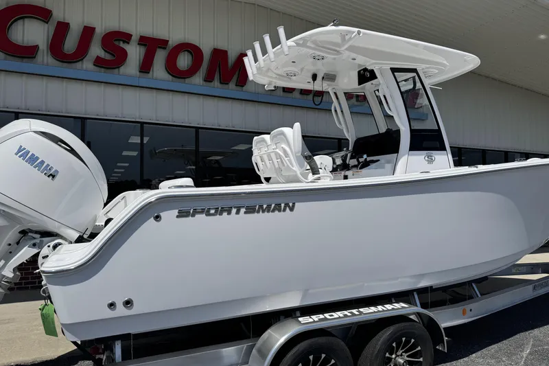 Slide: The Image of 2026 Sportsman Open 252 Center Console boat with Yamaha engine displayed outside dealership. - 3