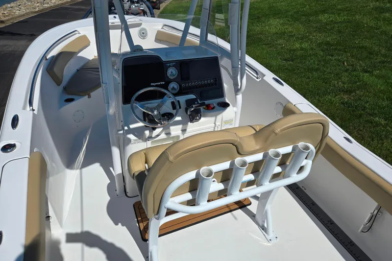 Slide: The Image of 2016 Tidewater 220 LXF boat interior with helm, seating, and rod holders. - 10