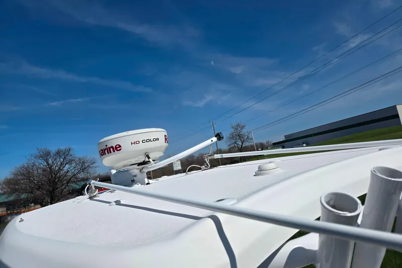 Slide: The Image of Radar equipment on a 2016 Tidewater 220 LXF boat under a clear blue sky. - 11