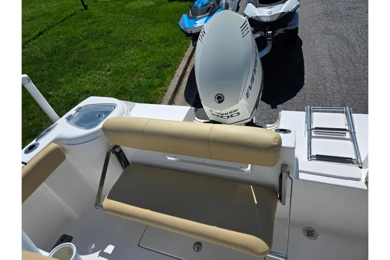 Slide: The Image of 2016 Tidewater 220 LXF boat with Evinrude engine and beige seating. - 21