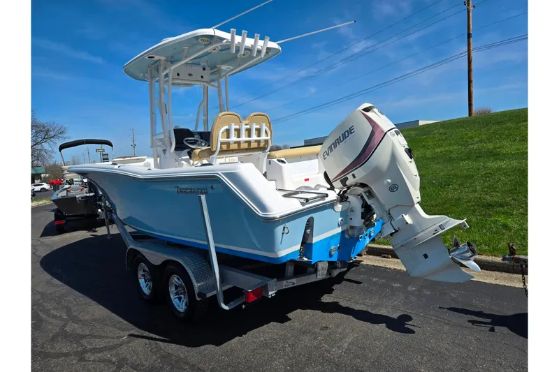 Slide: The Image of 2016 Tidewater 220 LXF boat with Evinrude outboard motor on trailer. - 3