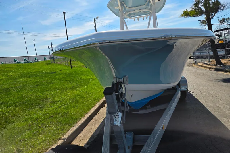 Slide: The Image of 2016 Tidewater 220 LXF boat on trailer, parked on a sunny day. - 6
