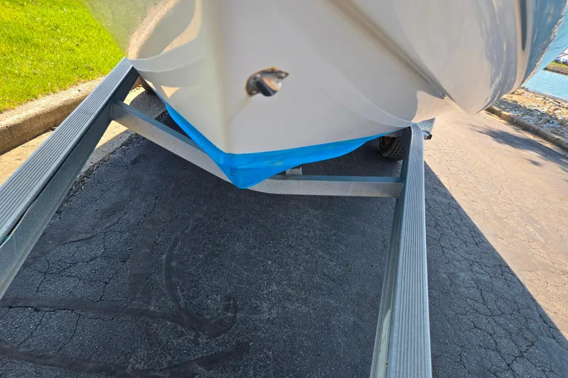 Slide: The Image of 2016 Tidewater 220 LXF boat on trailer, parked on asphalt. - 7