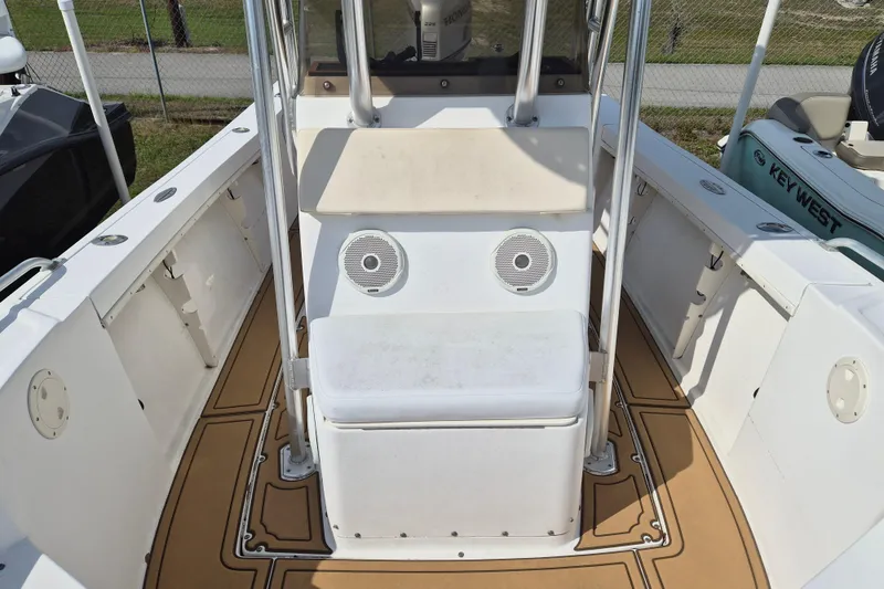 Slide: The Image of 2002 Mako 221 Center Console boat interior with seating and speakers. - 12