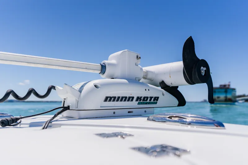 Slide: The Image of Minn Kota trolling motor on 2017 Barker Boatworks 26, ocean backdrop. - 14