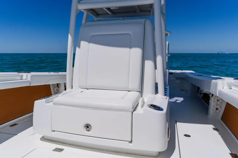 Slide: The Image of 2017 Barker Boatworks 26, white seating, ocean backdrop, sunny day. - 16