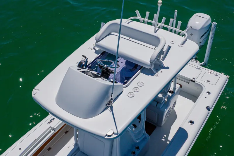 Slide: The Image of 2017 Barker Boatworks 26 model on clear water, showcasing helm and seating area. - 3