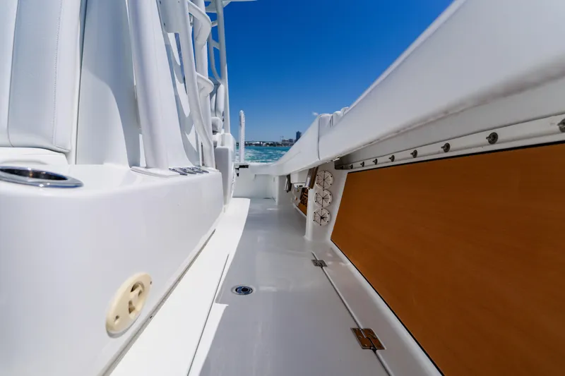 Slide: The Image of 2017 Barker Boatworks 26 interior view with sleek design and ocean backdrop. - 32