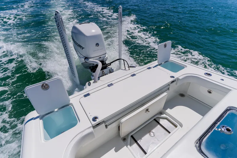 Slide: The Image of 2017 Barker Boatworks 26 with Mercury engine cruising on open water. - 38