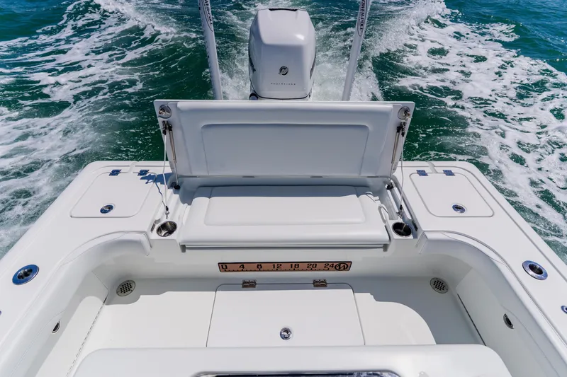 Slide: The Image of 2017 Barker Boatworks 26, rear view, white deck, outboard motor, ocean waves. - 39