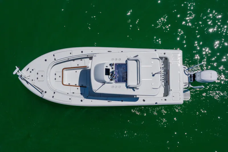 Slide: The Image of Overhead view of 2017 Barker Boatworks 26 on sparkling green water. - 4