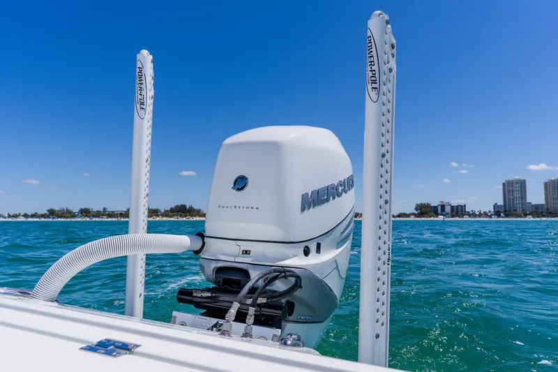 Slide: The Image of 2017 Barker Boatworks 26 with Mercury engine on blue ocean water. - 40