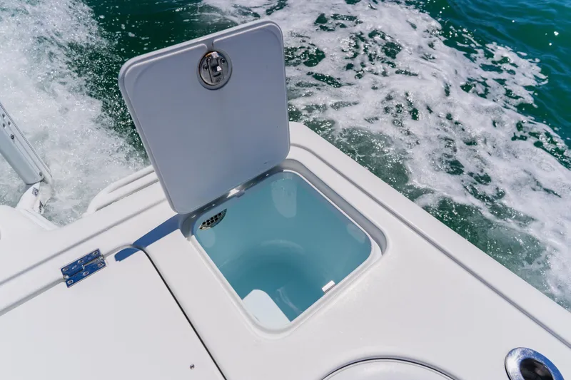Slide: The Image of Open hatch on 2017 Barker Boatworks 26, with ocean waves in the background. - 43