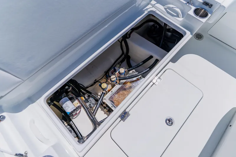 Slide: The Image of Open hatch of a 2017 Barker Boatworks 26, revealing internal components and wiring. - 45