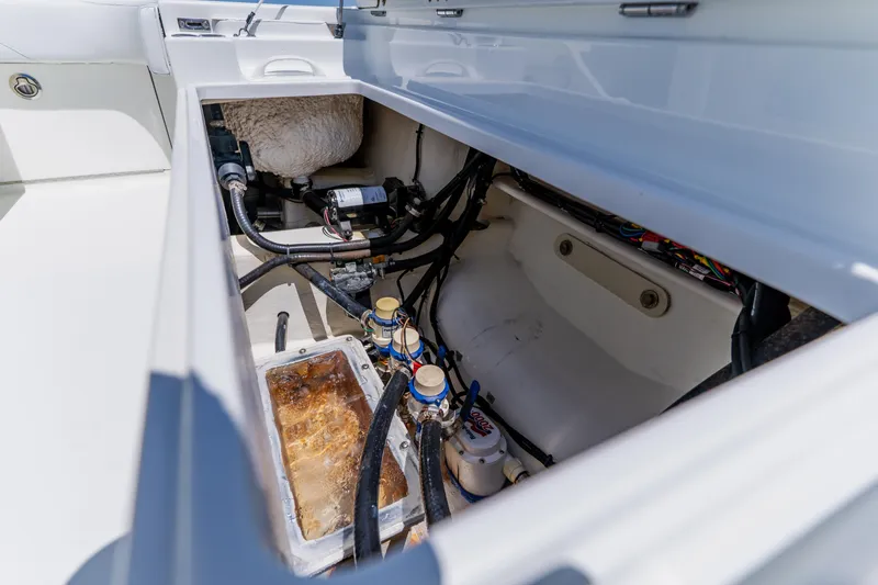 Slide: The Image of Open hatch of 2017 Barker Boatworks 26 showing internal components and wiring. - 47