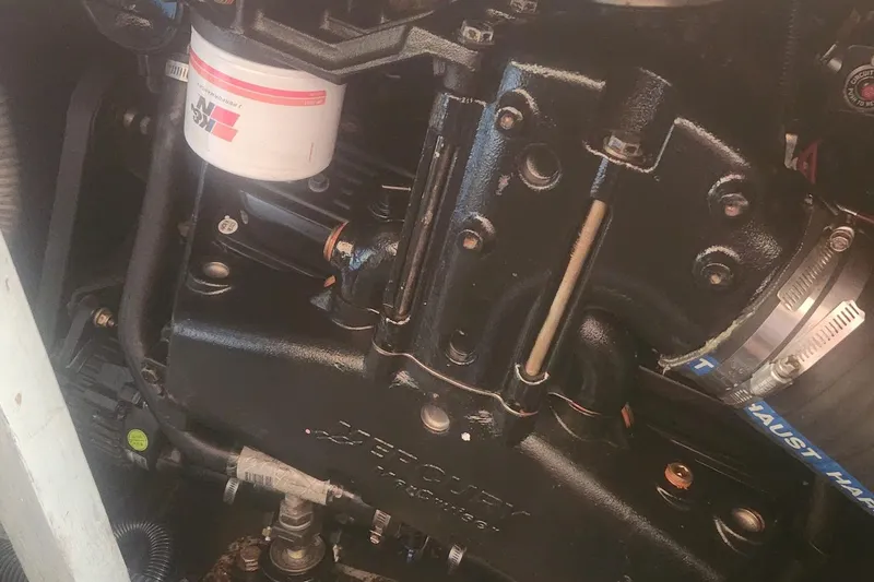 Slide: The Image of Engine compartment of a 1985 Bertram 33 Flybridge Cruiser with visible components. - 29