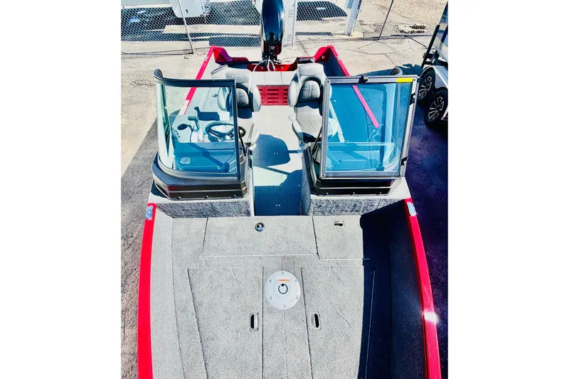 Slide: The Image of 2026 Lund 1650 Angler Sport boat with red accents and dual windshields. - 18