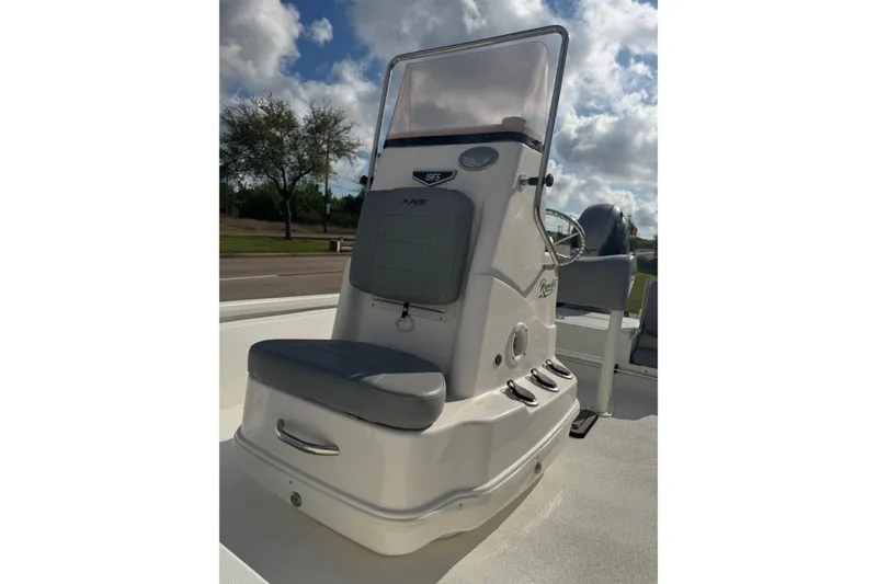 Slide: The Image of 2022 Avid 19 FS boat console with seating, under a partly cloudy sky. - 18