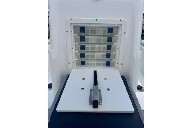 Slide: The Image of Storage compartment on a 2022 Avid 19 FS boat, featuring multiple drawers. - 25