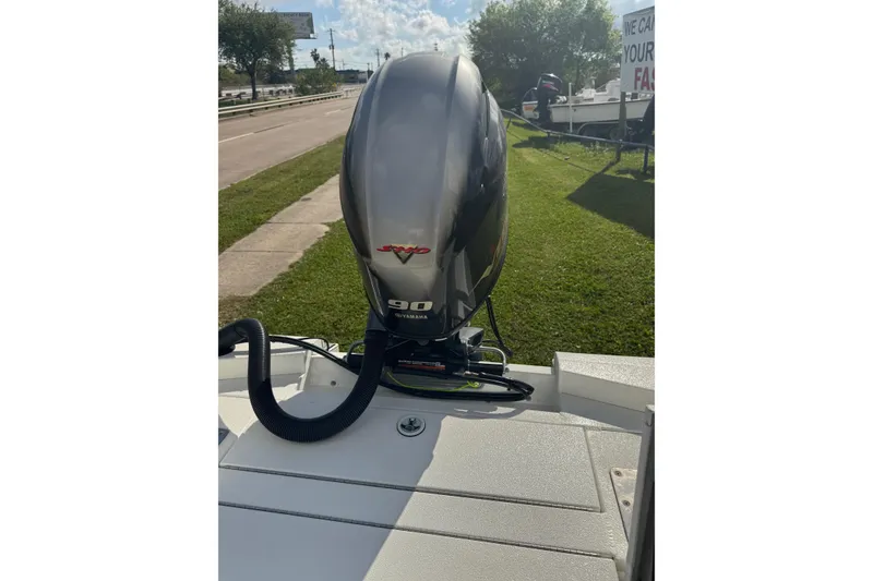 Slide: The Image of 2022 Avid 19 FS boat with Yamaha 90 engine on a sunny day. - 28