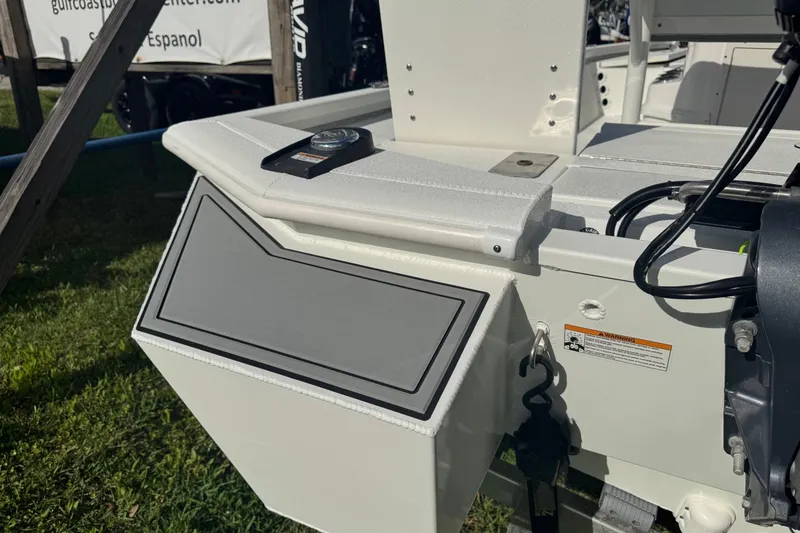 Slide: The Image of 2022 Avid 19 FS boat detail with storage compartment and engine components. - 8