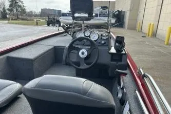 Slide: The Image of 2024 Tracker Pro 170 boat interior with steering wheel and dashboard controls. - 3