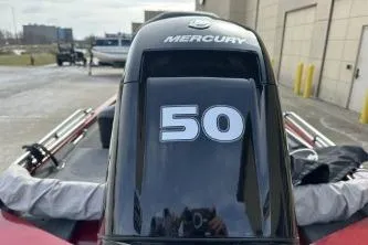 Slide: The Image of 2024 Tracker Pro 170 boat with Mercury 50 horsepower engine in outdoor setting. - 4