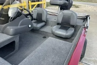 Slide: The Image of 2024 Tracker Pro 170 boat interior with gray seating and steering console. - 5