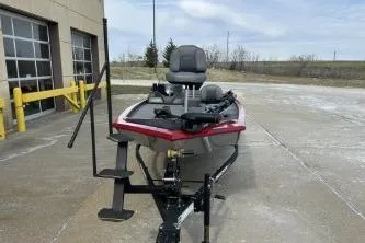 Slide: The Image of 2024 Tracker Pro 170 boat on trailer, parked outdoors near a building. - 6