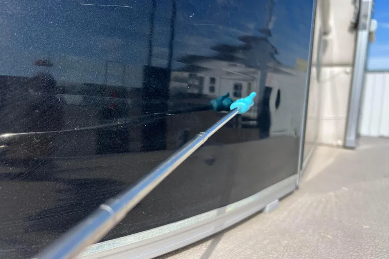 Slide: The Image of Close-up of Avalon Catalina Cruise 23' 2015 boat exterior with reflection and blue detail. - 17