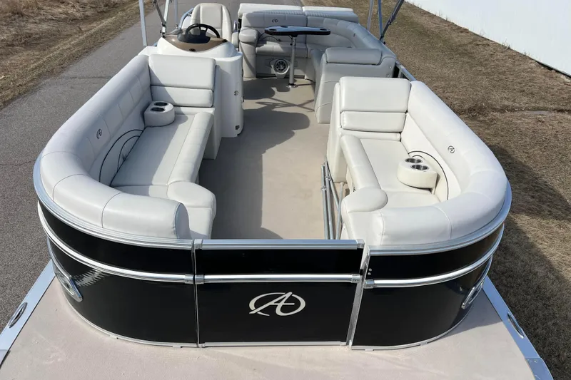 Slide: The Image of 2015 Avalon Catalina Cruise 23' pontoon boat with spacious seating and sleek design. - 2