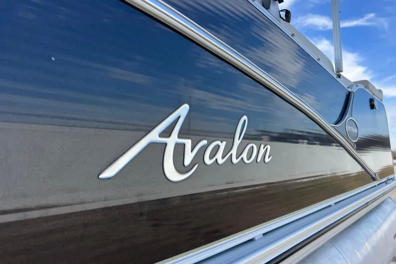 Slide: The Image of 2015 Avalon Catalina Cruise 23' boat with sleek design and logo detail. - 24