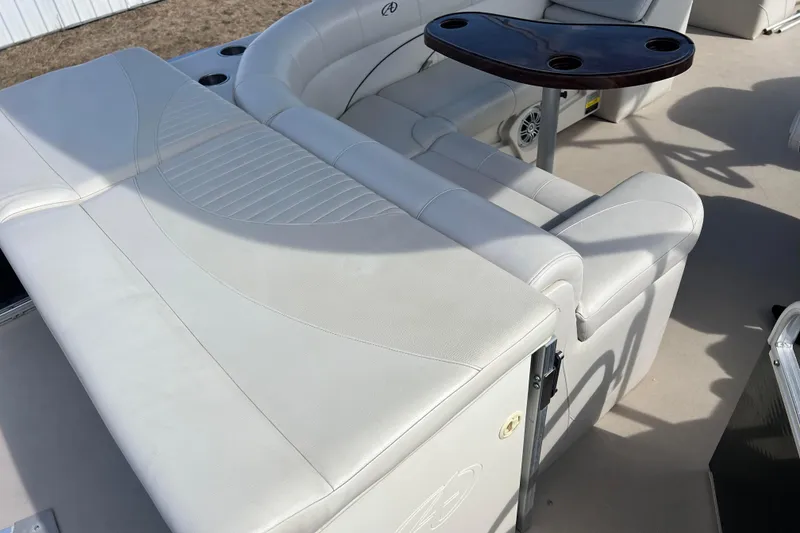 Slide: The Image of 2015 Avalon Catalina Cruise 23' boat interior with white seating and table. - 30