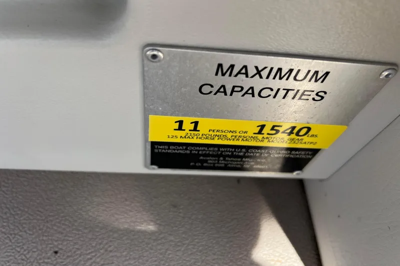 Slide: The Image of 2015 Avalon Catalina Cruise boat capacity plate, maximum 11 persons or 1540 lbs. - 38