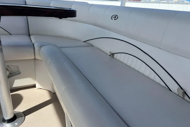 Slide: The Image of Luxurious seating on a 2015 Avalon Catalina Cruise 23' boat with elegant white upholstery. - 39