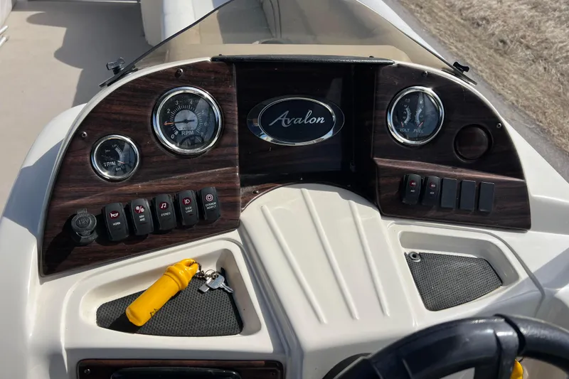 Slide: The Image of Dashboard of 2015 Avalon Catalina Cruise 23' boat with gauges and controls. - 42
