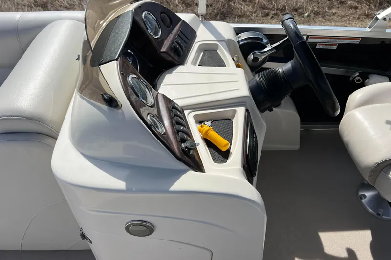 Slide: The Image of Steering console of 2015 Avalon Catalina Cruise 23' boat with gauges and controls. - 44