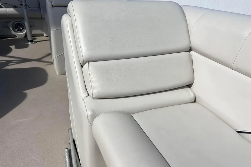 Slide: The Image of Luxurious seating on a 2015 Avalon Catalina Cruise 23' boat, featuring plush, light-colored upholstery. - 51