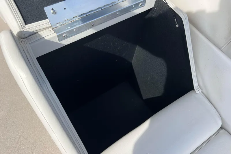 Slide: The Image of Open storage compartment on 2015 Avalon Catalina Cruise boat seat. - 52