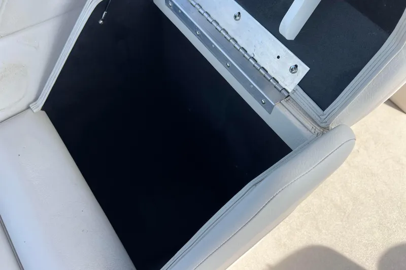 Slide: The Image of Open storage compartment on 2015 Avalon Catalina Cruise boat seat. - 53