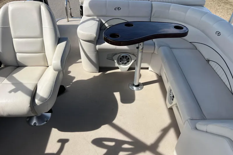 Slide: The Image of Interior of 2015 Avalon Catalina Cruise boat with white seating and table. - 57