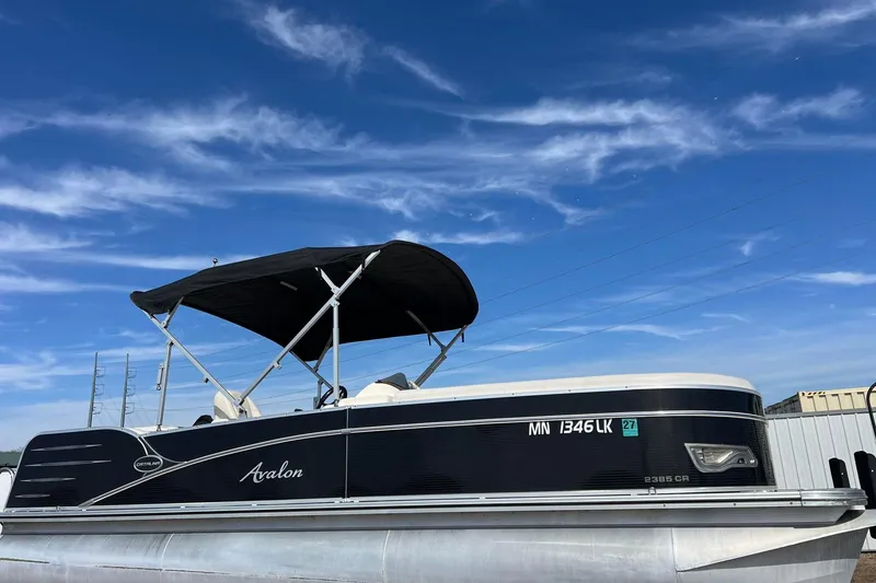 Slide: The Image of 2015 Avalon Catalina Cruise 23' pontoon boat under a clear blue sky. - 58