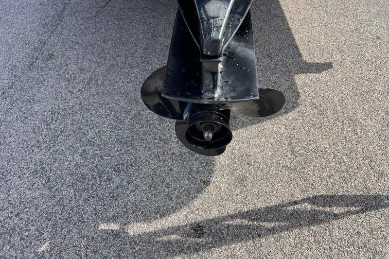 Slide: The Image of Close-up of a 2015 Avalon Catalina Cruise 23' boat propeller on pavement. - 7