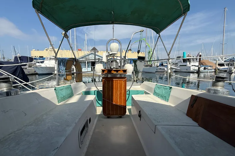 Slide: The Image of Cockpit view of 1987 Catalina 36 sailboat docked in a marina. - 11