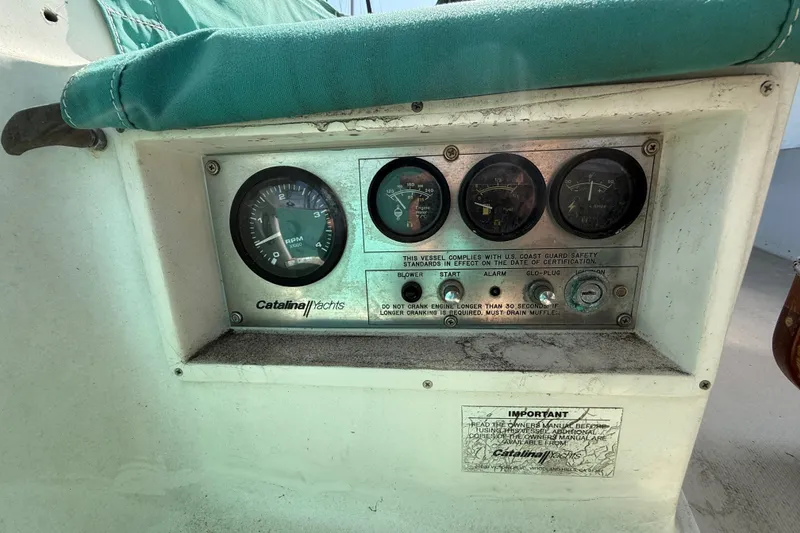 Slide: The Image of Control panel of a 1987 Catalina 36 yacht with gauges and instructions. - 14